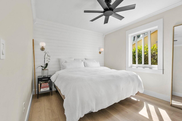 1630 N Ocean Breeze, Lake Worth Beach, FL 33460 - bedroom featuring ornamental molding, baseboards, wood finished floors, ceiling fan, and wood walls