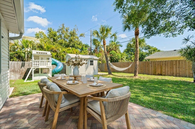 1630 N Ocean Breeze, Lake Worth Beach, FL 33460 - view of patio with outdoor dining space and a playground