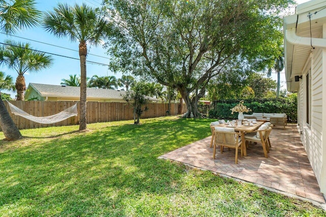 view of yard featuring a patio area and a fenced backyard