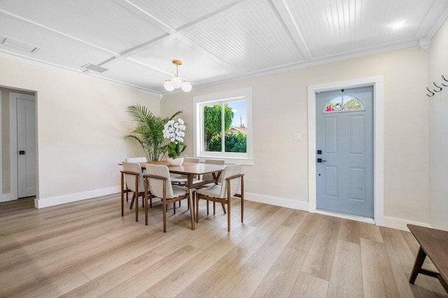 1630 N Ocean Breeze, Lake Worth Beach, FL 33460 - dining space with light wood finished floors, baseboards, ornamental molding, and coffered ceiling