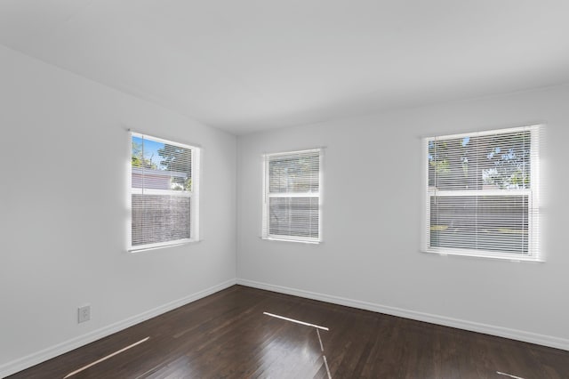 unfurnished room featuring dark hardwood / wood-style floors