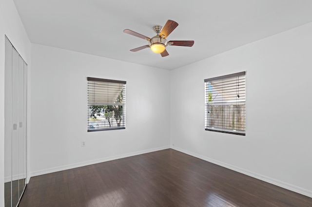 empty room featuring hardwood / wood-style flooring and ceiling fan