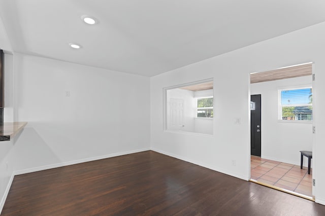 unfurnished living room with wood-type flooring