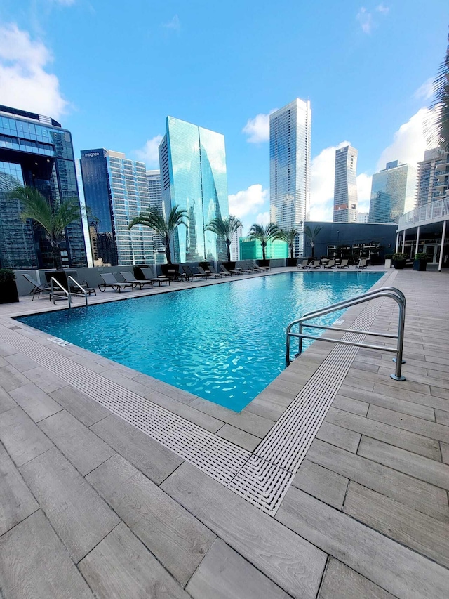 view of swimming pool with a patio area