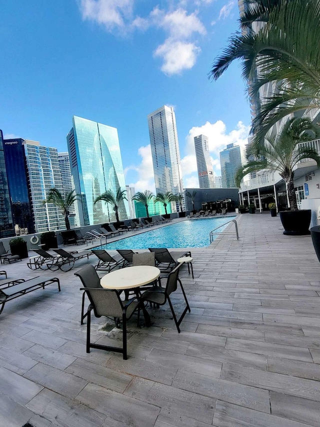 view of swimming pool with a patio area