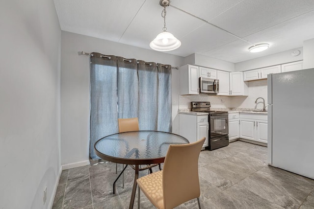 dining room featuring baseboards