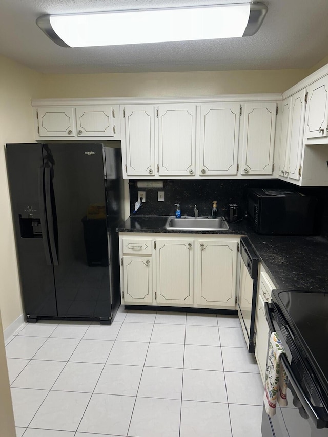 kitchen with white cabinetry, light tile patterned floors, sink, and black appliances