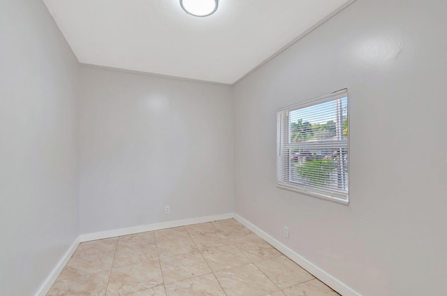 empty room with baseboards