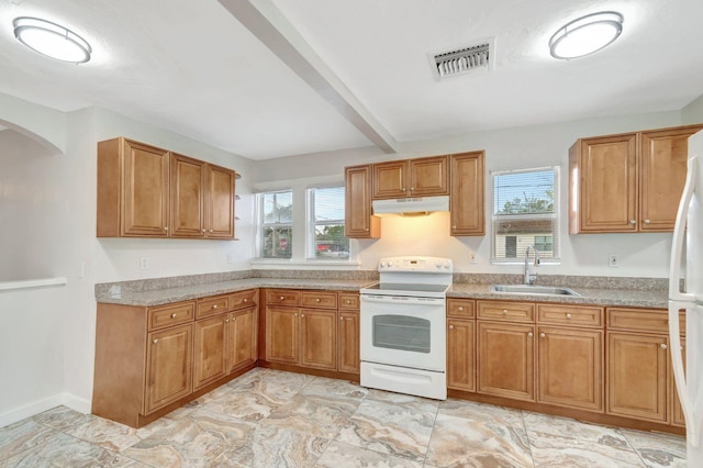 kitchen with light countertops, visible vents, a sink, white appliances, and under cabinet range hood