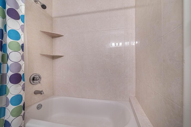 bathroom featuring a textured ceiling, tile patterned flooring, vanity, and a notable chandelier