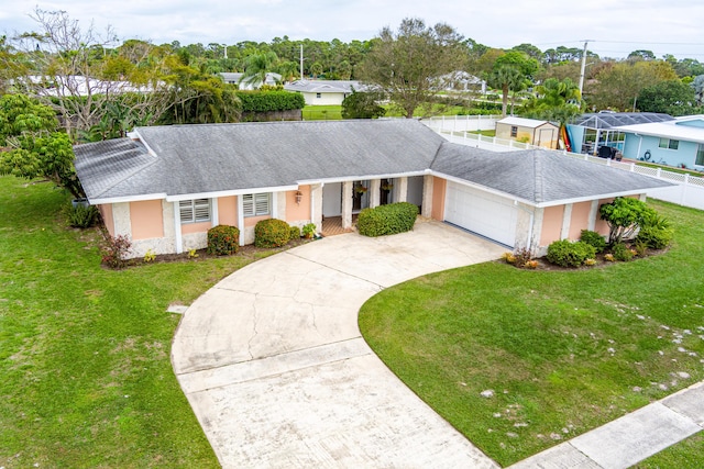 single story home with a front lawn and a garage