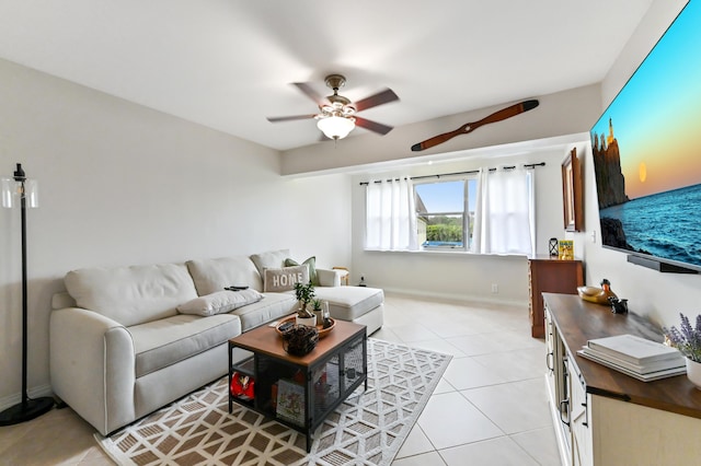 living room featuring ceiling fan and light tile patterned floors