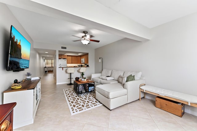 living room featuring ceiling fan and light tile patterned floors