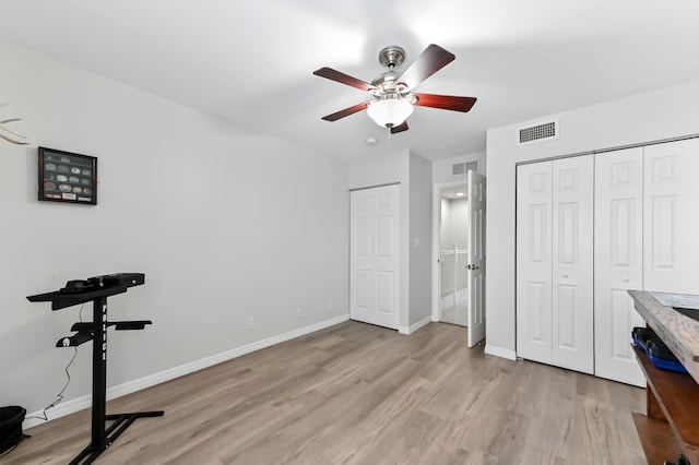 bedroom featuring ceiling fan and light hardwood / wood-style floors