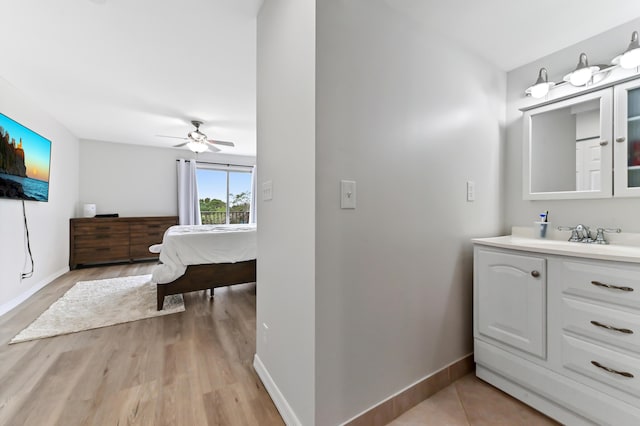 bathroom with vanity and ceiling fan