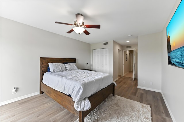 bedroom featuring hardwood / wood-style flooring and ceiling fan