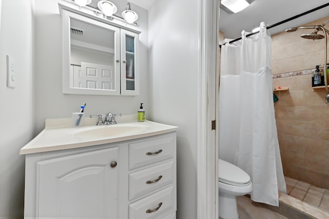 bathroom with vanity, a shower with shower curtain, and toilet