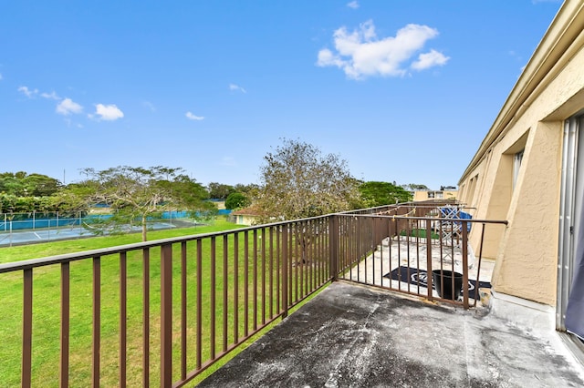 balcony featuring a water view