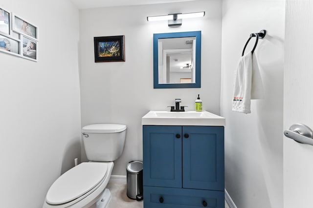 bathroom with toilet and vanity