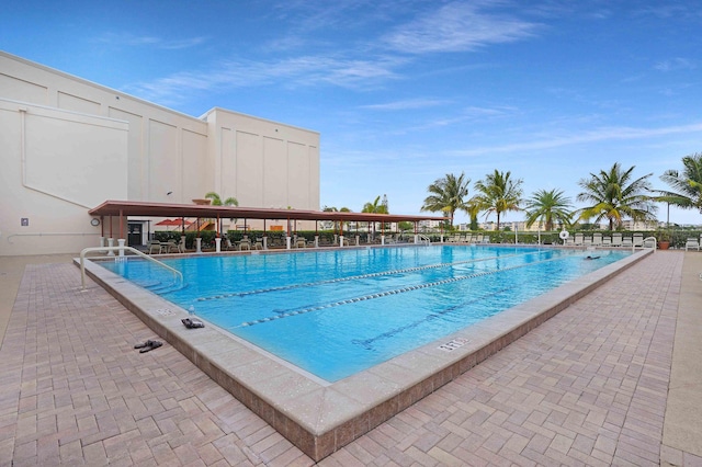 view of swimming pool with a patio