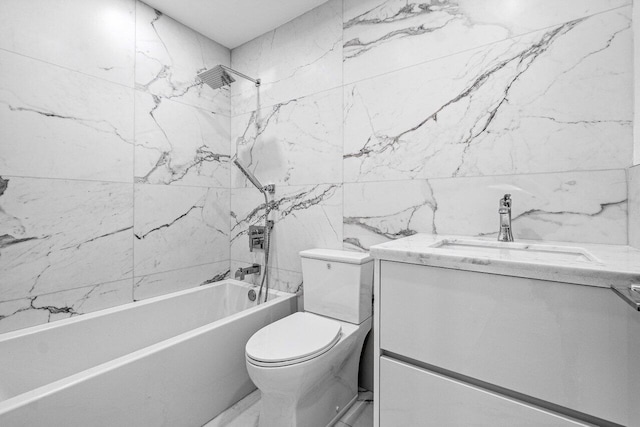 full bathroom featuring tiled shower / bath, vanity, and toilet