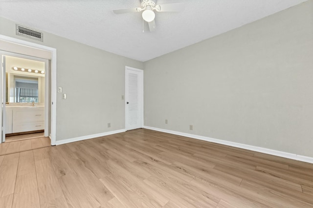 364 Capri H, Delray Beach, FL 33484 - empty room with light hardwood / wood-style floors, ceiling fan, and a textured ceiling
