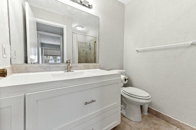 364 Capri H, Delray Beach, FL 33484 - bathroom with tile patterned floors, toilet, vanity, and walk in shower