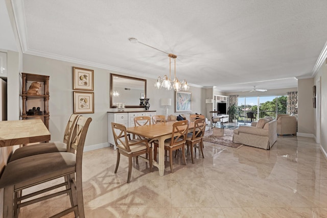 dining space with crown molding, ceiling fan with notable chandelier, baseboards, and a textured ceiling