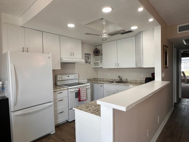 kitchen featuring white appliances, ceiling fan, sink, white cabinetry, and kitchen peninsula