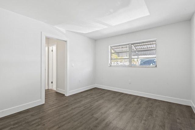 unfurnished room featuring dark hardwood / wood-style floors