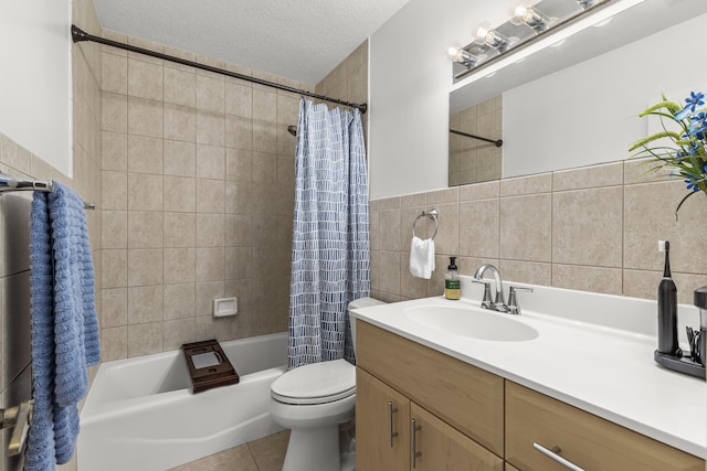 bathroom featuring toilet, vanity, tile patterned floors, shower / bath combination with curtain, and a textured ceiling