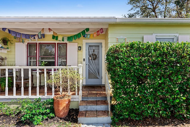 entrance to property with covered porch