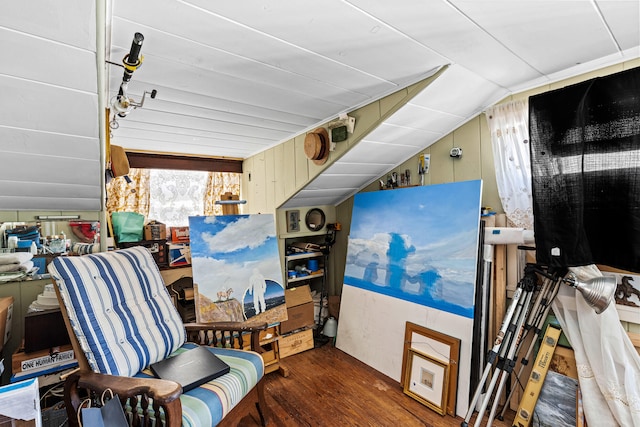 interior space with dark wood-type flooring and vaulted ceiling