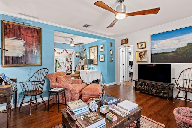 living room with ceiling fan, dark hardwood / wood-style floors, and ornamental molding