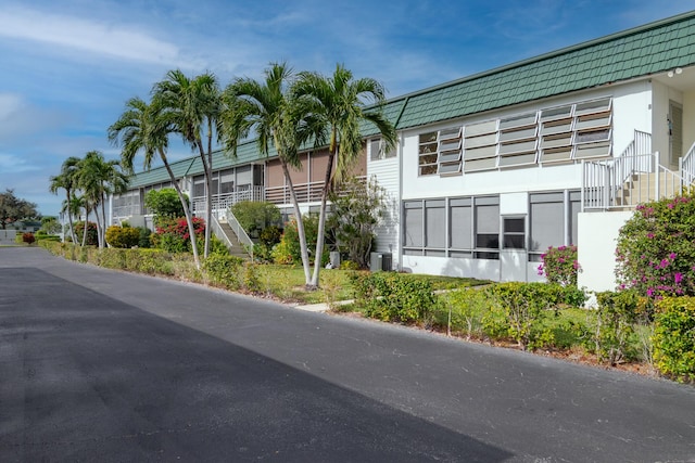 view of property with central air condition unit