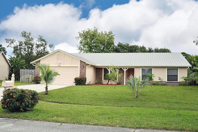 single story home with a garage and a front lawn