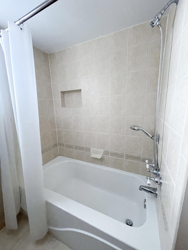 bathroom with shower / bath combination with curtain and tile patterned floors