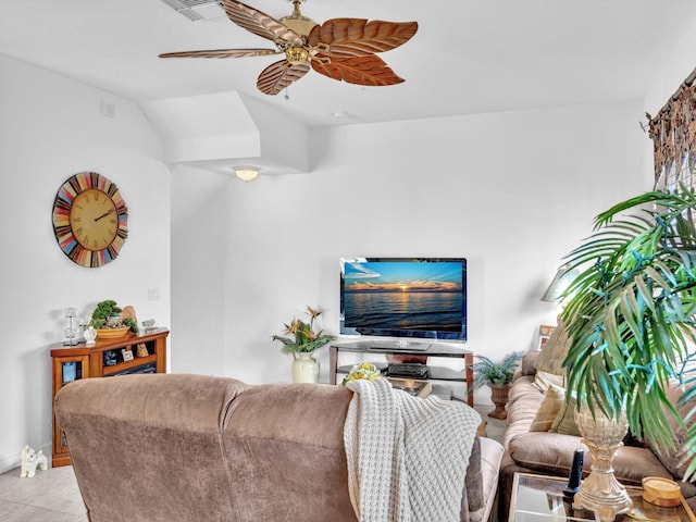 tiled living room with ceiling fan and lofted ceiling