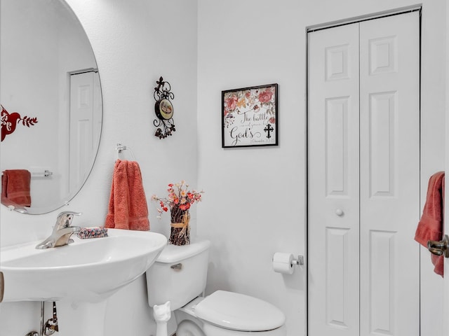 bathroom with toilet and sink