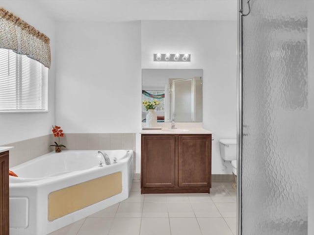 full bathroom featuring tile patterned floors, vanity, toilet, and independent shower and bath