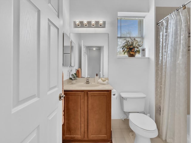 full bathroom with shower / tub combo with curtain, vanity, toilet, and tile patterned flooring