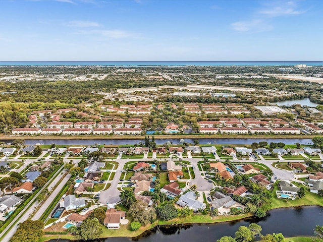 birds eye view of property featuring a water view