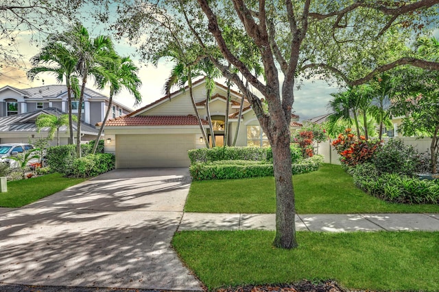 view of front of property featuring a garage and a front yard