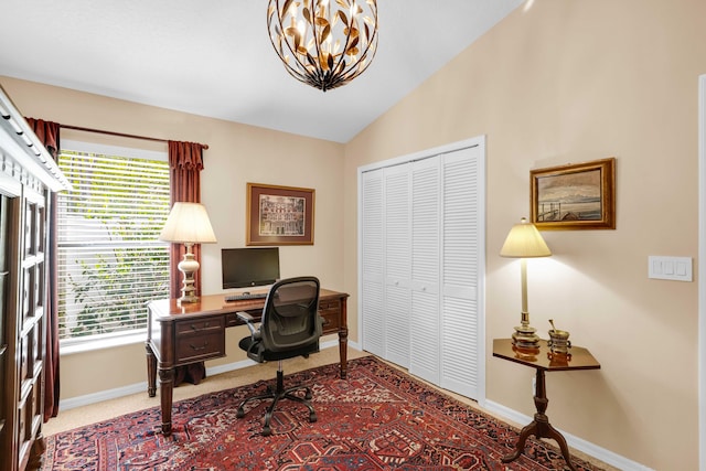 office space with lofted ceiling and a notable chandelier