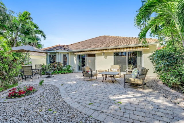 back of house featuring a patio area