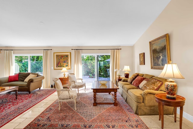 living room featuring lofted ceiling and a wealth of natural light