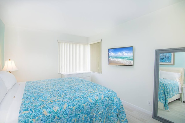 bedroom with light hardwood / wood-style flooring