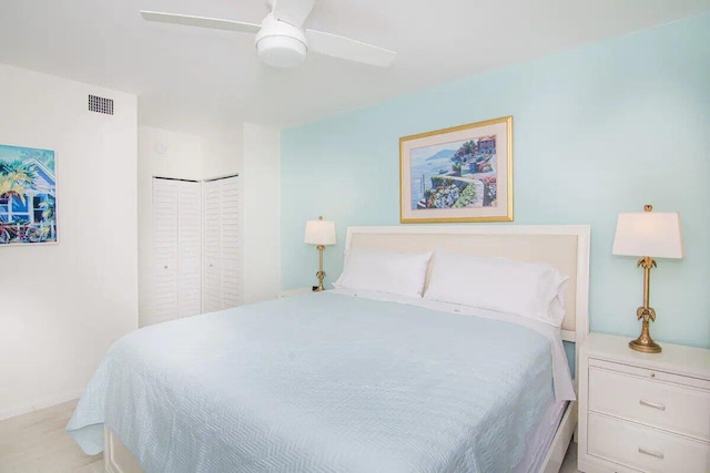 bedroom with ceiling fan and a closet