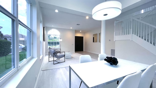 dining space with light wood-type flooring