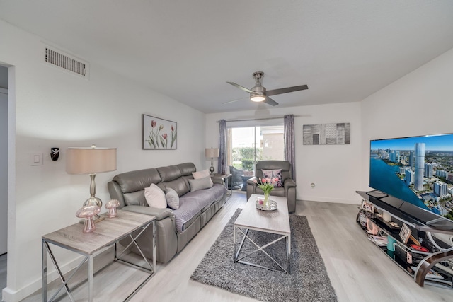 927 Riverside Dr Unit 313, Coral Springs, FL 33071 - living area featuring light wood-style flooring, ceiling fan, and baseboards